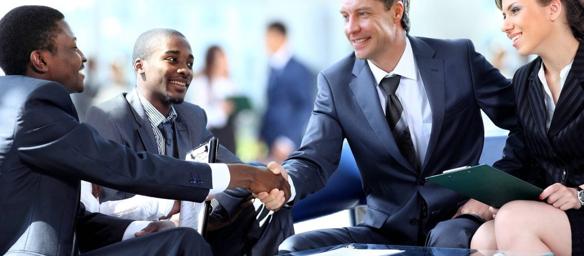 Business people shaking hands, finishing up a meeting